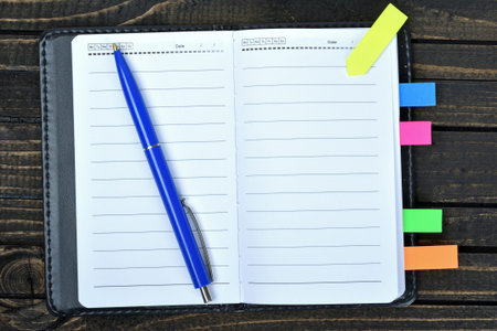 Empty notepad on wooden table