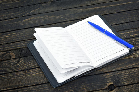 Empty notepad on wooden table