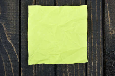 Empty note on wooden tableの写真素材