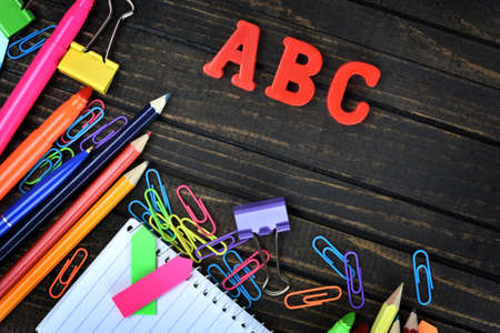ABC and office tools on wooden tableの写真素材