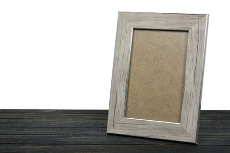 Photo frame on wooden table