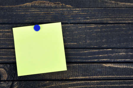 Empty note on wooden tableの写真素材