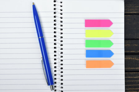 Empty notepad on wooden tableの写真素材