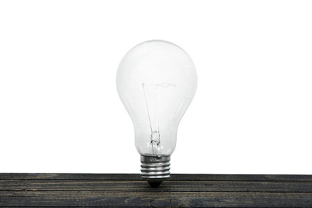 Light bulb on wooden tableの写真素材