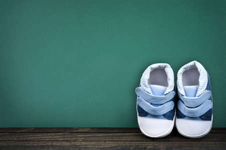 Kid shoes on school tableの写真素材