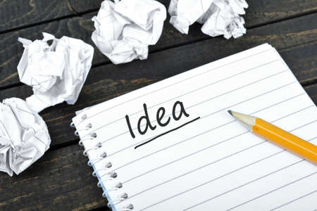 Idea text on notepad and crippled paperの写真素材