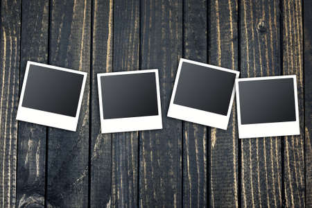 Many instant photos on wooden tableの写真素材