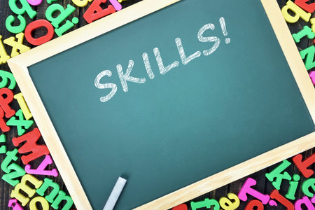Skills text on school board and magnetic letters