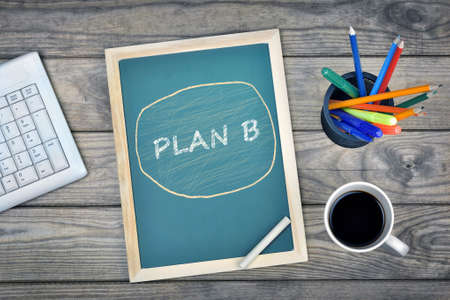 Plan B text on school board and coffee on deskの写真素材