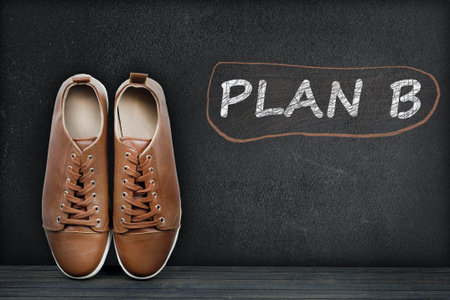 Plan B text on black board and shoesの写真素材