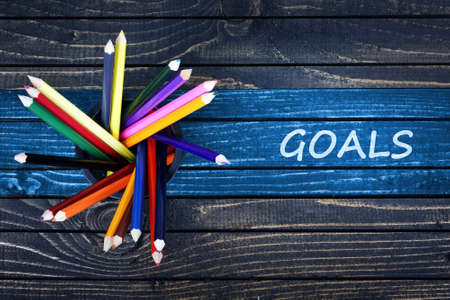 Goals text painted and group of pencils on wooden tableの写真素材