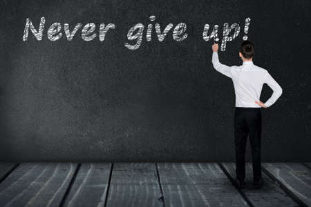 Never give up text write on black boardの写真素材