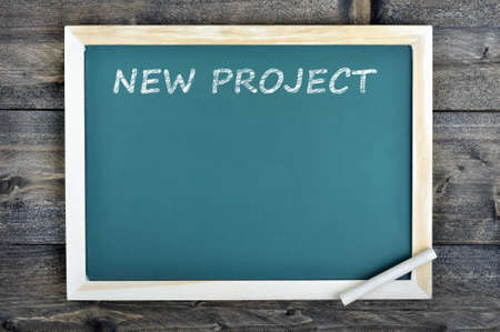 New Project text on school board and chalk on wooden tableの写真素材