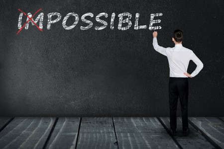 Impossible text write on black boardの写真素材