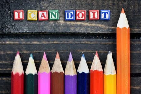 I can do it text and group of pencil on wooden tableの写真素材
