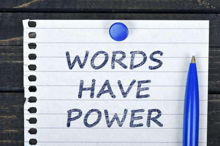 Words have power text on page and pen on wooden tableの写真素材