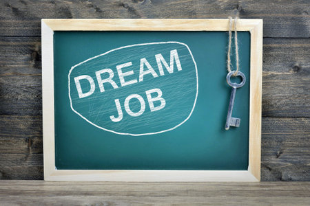 Dream Job text on school board and old keyの写真素材