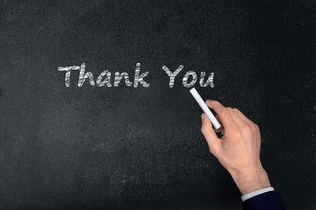 Thank You text write on black boardの写真素材