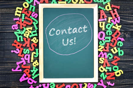 Contact Us text on school board and magnetic lettersの写真素材