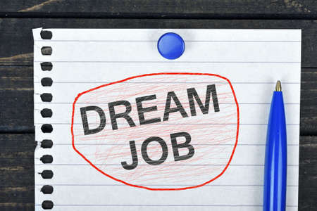 Dream Job text on page and pen on wooden tableの写真素材