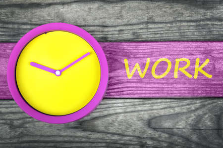 Work message and clock on wooden tableの写真素材