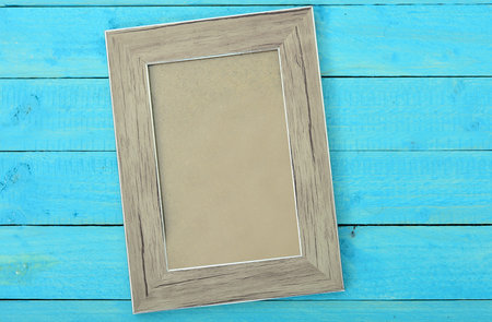Photo frame on wooden table