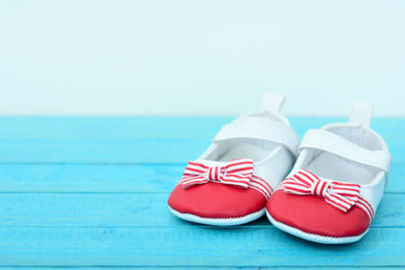 Kid shoes on wooden floorの写真素材