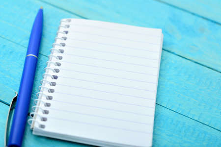 Empty notepad on wooden tableの写真素材