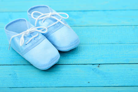 Kid shoes on wooden floorの写真素材