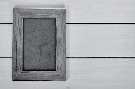 Photo frame on wooden tableの写真素材