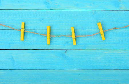 Four clips on wooden wallの写真素材