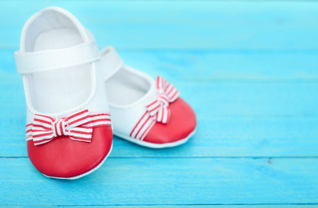 Kid shoes on wooden floorの写真素材