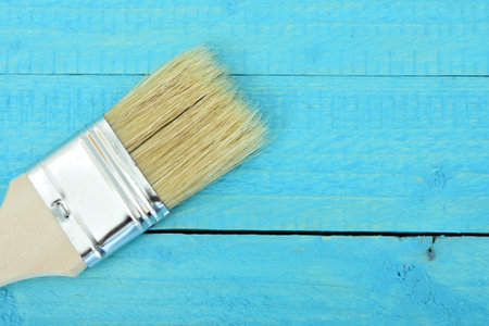 Paint brush on wooden table