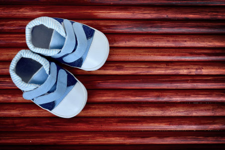 Kid shoes on wooden floorの写真素材