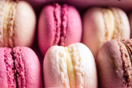 Colourful sweet tasty macaroons in a rowの写真素材