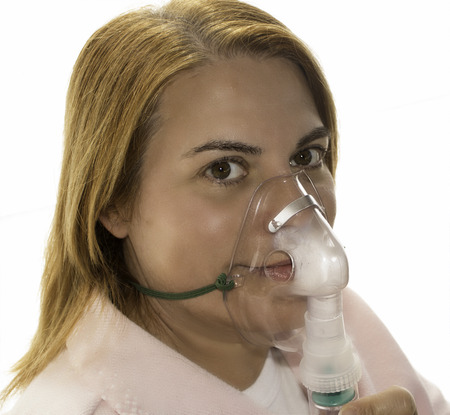 Woman smiling with Oxygen maskの写真素材