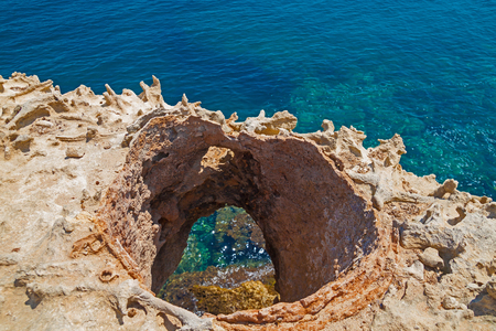 Beautiful sea lagoon view from the cliff near Grotto della Poesia, Salento, Italy in sunny summer dayの写真素材