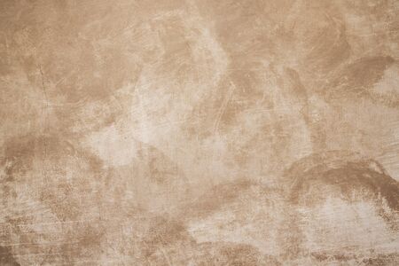 old brown scratched cement wall, part of vintage wall on street in Prague, aged background for designの写真素材