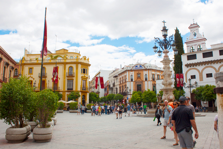 Seville, Spain, June 05, 2018: beautiful street in city center with historic buildings and old architecture, Seville, Andalusia, Spainのeditorial素材