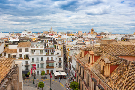 Seville, Spain, June 05, 2018: beautiful view of street in city center with historic buildings and old architecture, aerial view,  dramatic sky. Seville, Andalusia, Spainのeditorial素材