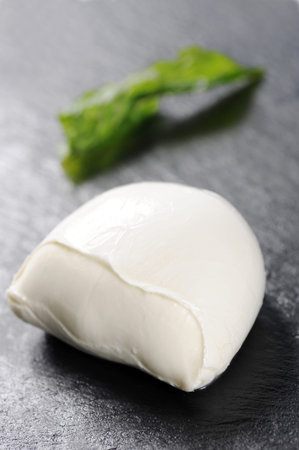 typical Italian meal from the Campania area buffalo mozzarella and fried basil made by a chef with a...