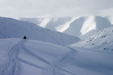 Snowmobile at top of mountainの写真素材