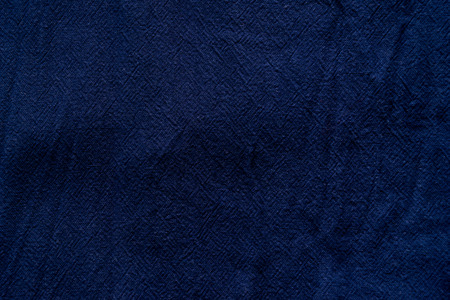 Blue texture of fabric from a textile material for an abstract background