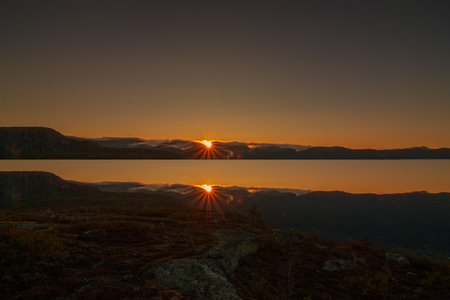scenic sunrise after a cold night in telemark, norwayの写真素材