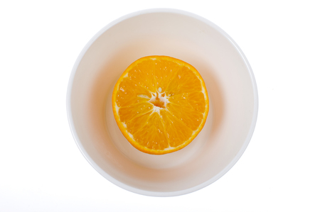orange and slice in bowlの写真素材