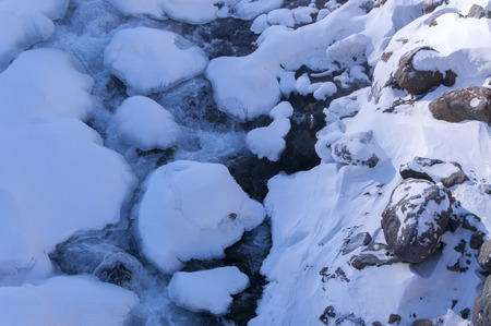 Snow cover the stoneの写真素材