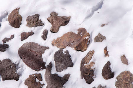 Snow cover the stoneの写真素材