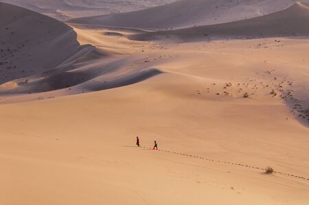 People walking in the desertの写真素材