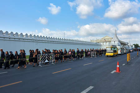Group of people walking outside the Grand Palace, Thailandのeditorial素材