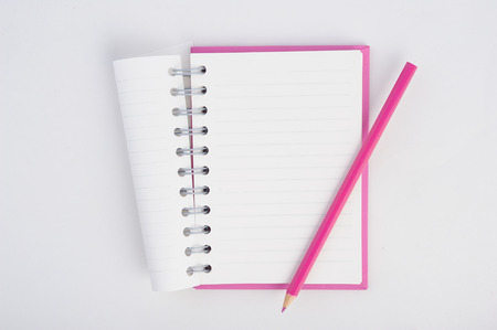 purple notebook and pen for background and textの写真素材